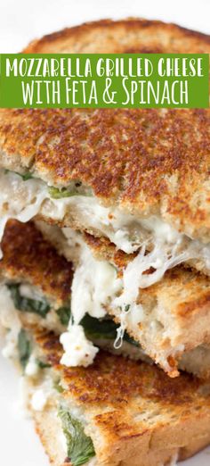 two grilled cheese sandwiches with feta and spinach on a white plate text reads mozzarella grilled cheese with feta and spinach