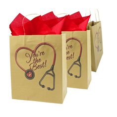 two brown shopping bags with red handles and stethoscopes on the front