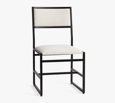 a black and white chair with a beige seat pad on the back of it, against a white background