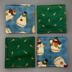 four snowmen on blue and green fabric coasters