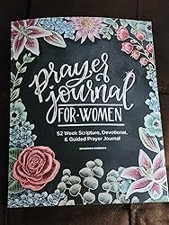 the front cover of a book with flowers on it and writing in white ink that reads, prayer journal for women