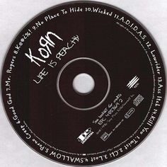 a cd disc with writing on it that says xox life story written in cursive ink