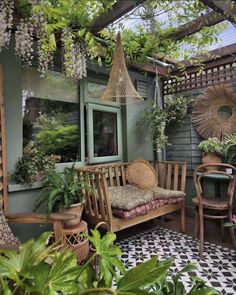 an outdoor area with plants and furniture