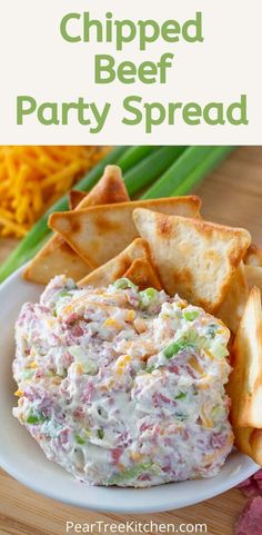 a white plate topped with cheese and crackers