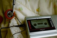 an old fashioned radio sitting on top of a bed