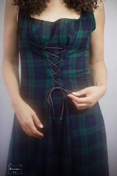 "Long dress in viscose/polyester tartan Fluid and light,  you slip into it to feel both elegant and very comfortable.  A lacing system on the front made of satin ribbon makes it original and highlights the waist.  It closes with an invisible zip in the middle of the back.  Beautiful hem finishes and cotton bias binding.  \"The Shadow\" dress is machine washable at 30oC.  Some measurements: Length: 125cm  Possible sizes are 36, 38, 40, 42, 44, 46  Chest circumference: 36= 86cm, 38= 90cm, 40=94cm, 42=98cm, 44=102cm, 46=110cm   Do not size small or large, take your usual size. Flared shape that does not emphasize the hips.  It can be made in other tartan colors. (see range in photo)  This one is the tartan of the MacKay clan, predominantly green and blue.  Choose your clan!  The shadow dress Green Velvet Coat, Shadow Dress, Scottish Dress, Blue Tartan, Velvet Coat, Bias Binding, How To Make Ribbon, Under Dress, Pinafore Dress