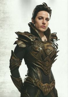 a woman dressed in armor standing with her hands on her hips