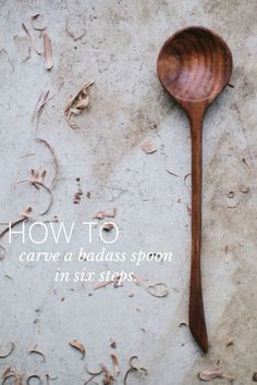 a wooden spoon sitting on top of a cement floor