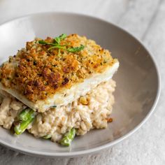 a white plate topped with fish and rice