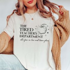 a woman wearing a t - shirt that says the tired teachers department