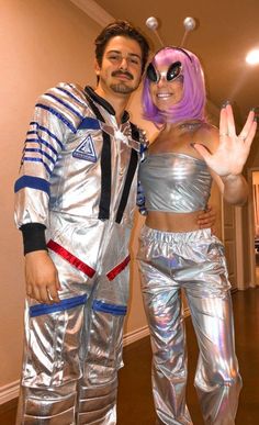 a man and woman dressed up in costumes