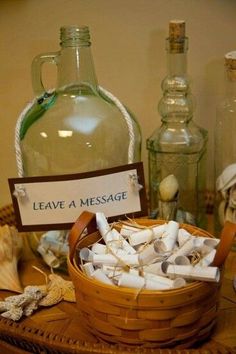 a basket full of sea shells next to bottles