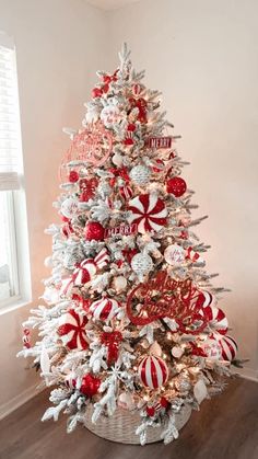 a christmas tree decorated with red and white candy canes