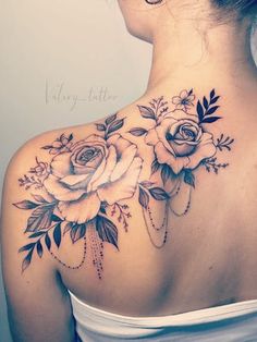 a woman with a flower tattoo on her back