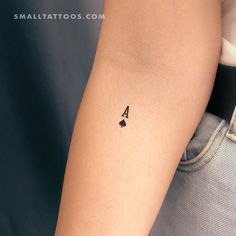 a person with a small tattoo on their arm