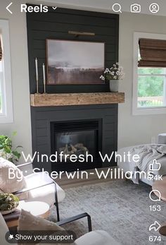 a living room filled with furniture and a fire place in front of a tv mounted on the wall