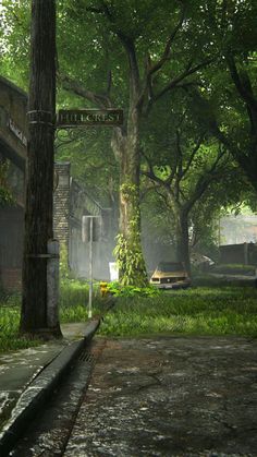 a street sign in the middle of a grassy area with trees and buildings behind it