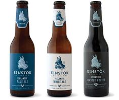 three different types of beer bottles with labels on them, one is blue and the other has white ale