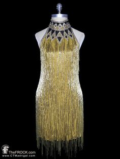 "BIG NEWS After 22 years, our website, TheFROCK.com, has had a makeover. Check out the new site, and join our mailing list for new arrivals.  Vintage Bob Mackie gold beaded fringe (on silk georgette) halter dress with contrast beaded halter neck, and nearly open back. Rear zipper entry. Condition is excellent with only an occasional discreet mark or discolor hidden on the interior. The dress would fit a variety of bust measurement as it has a largely open back, dress dress measures about 33.5\" Gold Couture, Vintage Bob Mackie, Vintage Bob, Beaded Jacket, Cocktail Gowns, Bob Mackie, Beaded Fringe, Beaded Dress, Silk Chiffon