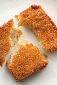 three pieces of cake sitting on top of a white surface