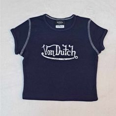 Brand New Without Tags Attached Size : 3t * Measurements Are Attached Color : Blue With White Lettering Please See All Attached Pictures For Any Additional Details Trendy Navy Top With Letter Print, Navy Tops With Letter Print For Spring, Navy Cotton Top With Letter Print, Navy Cotton Tops With Letter Print, Fitted Navy T-shirt For Spring, Fitted Blue Tops With Logo Print, Von Dutch Shirt, Dutch Blue, Von Dutch