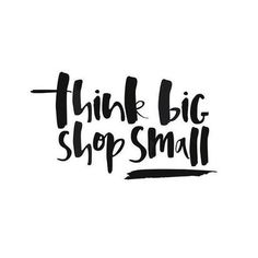 the words think big, shop small are written in black ink on a white background