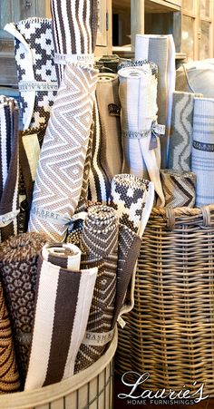 several baskets filled with different types of towels