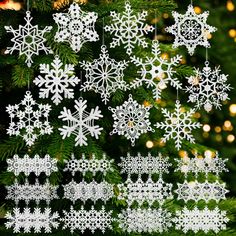 white snowflakes hanging from a christmas tree