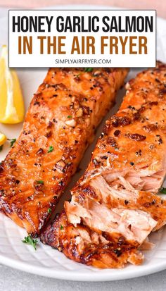 cooked honey garlic salmon fillets on white plate with text overlay "honey garlic salmon in the air fryer". Easter Entrees, Salmon Recipes Baked Healthy, Air Fryer Salmon, Honey Garlic Salmon, Air Fryer Fish, Garlic Salmon, Air Fryer Oven Recipes, Easy Salmon Recipes