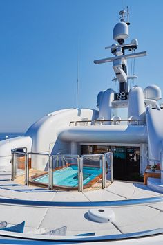 a large white boat sitting on top of a body of water