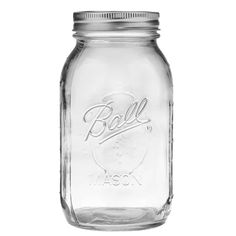 an empty mason jar with the lid open and writing bill on it's side