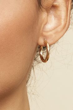 Modern boldness meets classic elegance in our Goddess Hoops. These thick, solid gold hoops feature a textured twist that's radiates shine. 10k Yellow Gold 3mm Tube, 15mm Diameter 1.3 Grams Solid Gold Hollowed Solid Gold Tube Latch Closure Crafted in Arezzo, Italy Gold Beaded Hoop Earrings, Brandy Melville Gold Hoop Earrings, Flat Gold Hoop Earrings, Medium Gold Hoop Earrings, Gender Collage, Gold Hoops Aesthetic, Gold Hoop Earrings Aesthetic, Minimal Jewelry Earrings, Earrings Hoop Gold