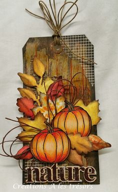 a tag with autumn leaves and pumpkins on it