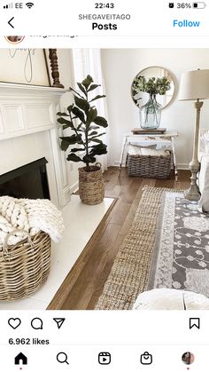 a living room filled with furniture and a fire place next to a mirror on the wall