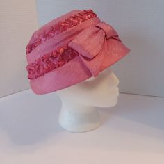 "This  is a vintage Mid Century Pink Bucket Hat with large Bow detail and pink raffia braiding around in 2 bands.  It is made of a shimmering shantung fabric design.  It has a very chic design, very reminiscent of the Mid Century era and very well made!! The inner diameter measures about 7\" x 7\". This hat is in amazing vintage condition.  The pink is still very Pink!! A very nice vintage hat for your Pink Collection!!" Adjustable Ribbon Hat For Kentucky Derby, Adjustable Hat With Ribbon For Kentucky Derby, Retro Pink Hat With Flat Brim, Retro Pink Wide Brim Hat, Fitted Hat With Ribbon And Curved Brim, Retro Pink Flat Brim Hat, Wide Brim Hat With Ribbon, Fitted Wide Brim Hat With Ribbon, Pink Retro Flat Brim Hat