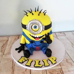 a cake that is shaped like a minion