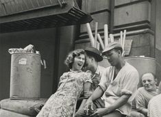 black and white photograph of people sitting on steps