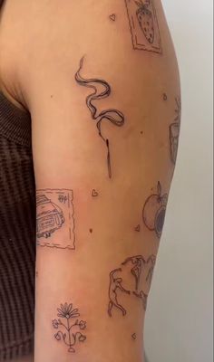 a woman's arm with tattoos on it and various things drawn on the arm