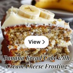 a banana bread cake with cream cheese frosting on a white plate next to bananas