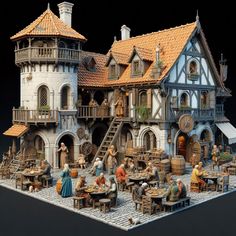 a model of a medieval house with people sitting around it