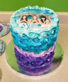 there is a cake that has been decorated with two women on it