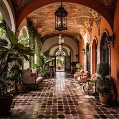 an arched hallway with potted plants on either side and two chairs in the middle