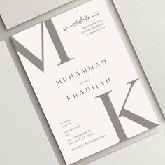 an elegant wedding card with the letter k on it's front and back side