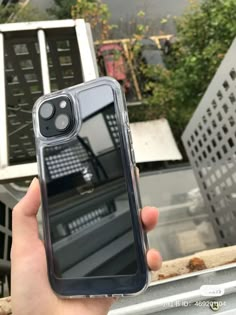 someone is holding up their iphone case in front of the camera and it's reflection