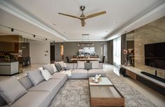 a living room filled with furniture and a flat screen tv