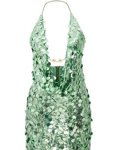 a green top with sequins on it