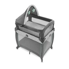 the baby crib is grey and has black trim