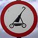 a red and white sign with a black outline of a lawn mower on it