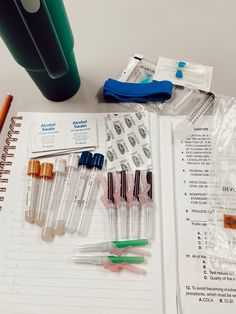 an assortment of medical supplies sitting on top of a table