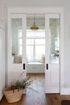 a room with white walls and wooden floors